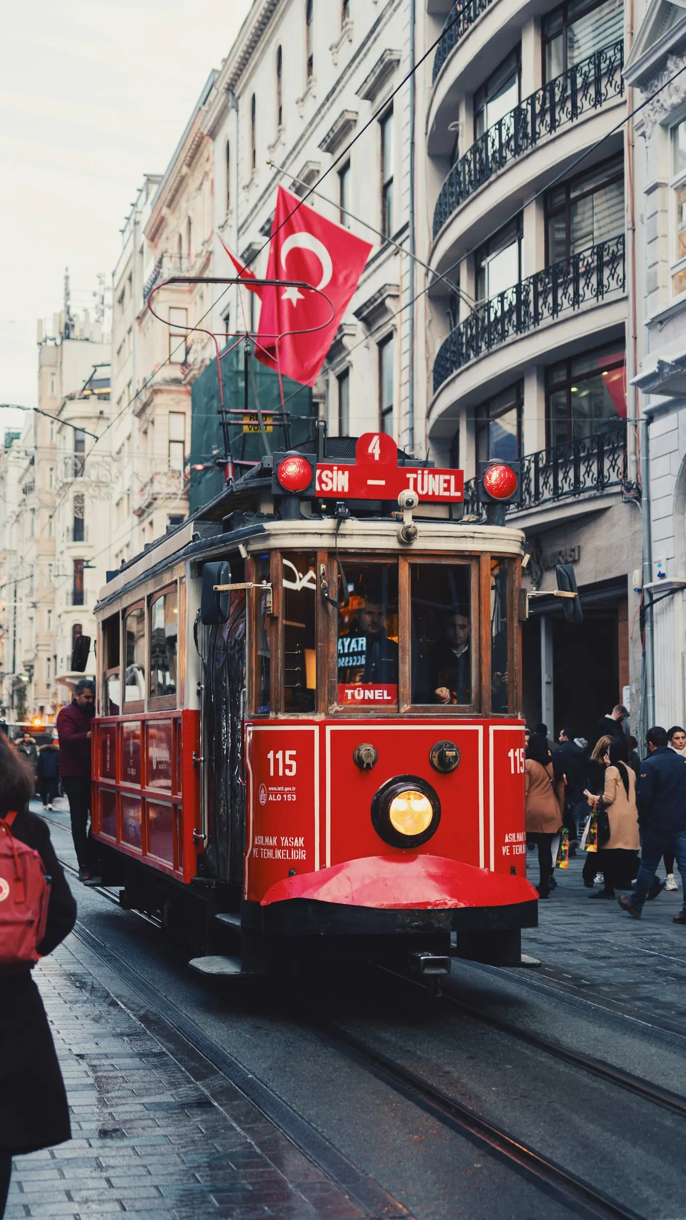 Red heritage tram on İstiklal Street near Taksim