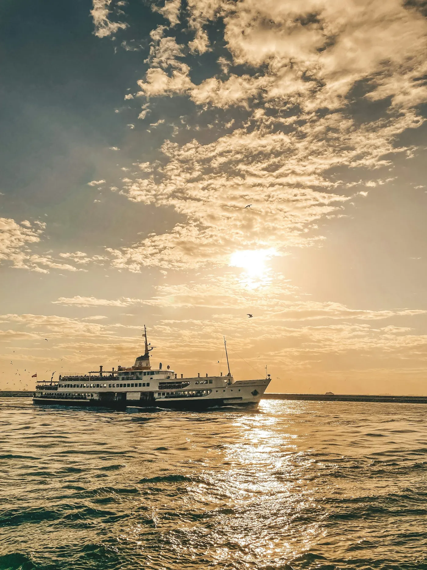 A city ferry approaching the Kadıköy pier
